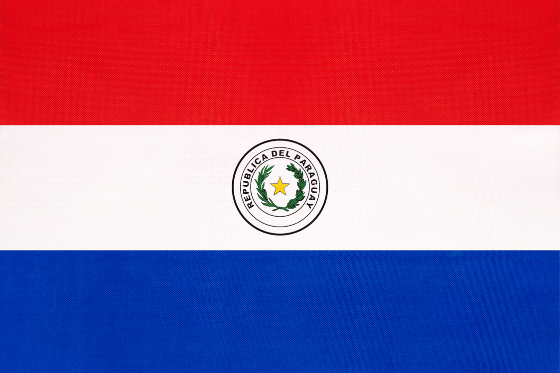 Paraguay national fabric flag, textile background. Paraguayan state official sign.